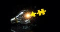 Eureka Moment: Broken Light Bulb and Puzzle Pieces Royalty Free Stock Photo