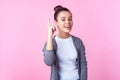 Eureka! Portrait of joyous brunette teenage girl pointing finger up, having brilliant idea. on pink background