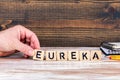 Eureka. Wooden letters on the office desk