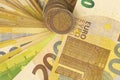 Euro background.Bundle of banknotes fan and column of euro coins.EU currency.Euro banknotes and coins.Money and finance Royalty Free Stock Photo