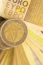 Euro background. Bundle of euro banknotes and column of euro coins. Euro money. Royalty Free Stock Photo