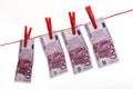 500 Euro bank notes hanging on clothesline Royalty Free Stock Photo