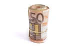 50 euro bank notes rolled and wrapped togethe standing up isolated on white