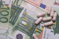 Euro banknote background with many pills as a concept of expensive drugs Royalty Free Stock Photo