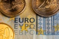 Euro banknote with coins. Closeup of EURO writing on money. Twenty Euro bill with two and one Euro coins. Fifty cents coin Royalty Free Stock Photo