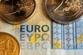 Euro banknote with coins. Closeup of EURO writing on money. Twenty Euro bill with two and one Euro coins. Fifty cents coin Royalty Free Stock Photo