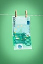 A 100 euro banknote dries on a rope Royalty Free Stock Photo