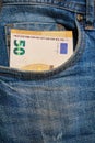 Euro banknote in the front pocket of blue jeans. Cash in your pocket. Royalty Free Stock Photo