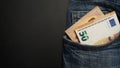 Euro banknote in the front pocket of blue jeans. Money in your pocket, cash. Royalty Free Stock Photo