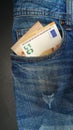 Euro banknote in the front pocket of blue jeans. Money in your pocket, cash. Royalty Free Stock Photo