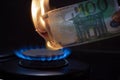 100 euro banknote on a gas burner. The concept of cost for natural gas. Energy crisis. High cost, gas price. Sanctions Royalty Free Stock Photo
