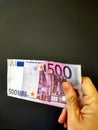 500 euro banknote held between fingers