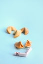 Euro banknote inside fortune cookies on blue background Royalty Free Stock Photo