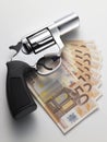Euro banknote and revolver Royalty Free Stock Photo