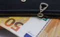 50 Euro banknotes in a black leather wallet close-up. The concept of cash, cash savings, prosperity. Euromoney