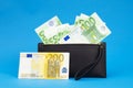 20  50  100  200 Euro banknotes in a black leather wallet close-up. The concept of cash  cash savings  prosperity. Euromoney Royalty Free Stock Photo