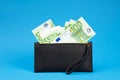 20  50  100  200 Euro banknotes in a black leather wallet close-up. The concept of cash  cash savings  prosperity. Euromoney Royalty Free Stock Photo