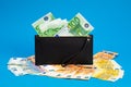 20  50  100  200 Euro banknotes in a black leather wallet close-up. The concept of cash  cash savings  prosperity. Euromoney Royalty Free Stock Photo