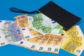 20  50  100  200 Euro banknotes in a black leather wallet close-up. The concept of cash  cash savings  prosperity. Euromoney Royalty Free Stock Photo