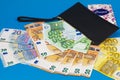 20  50  100  200 Euro banknotes in a black leather wallet close-up. The concept of cash  cash savings  prosperity. Euromoney Royalty Free Stock Photo
