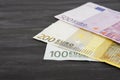 100, 200, 500 euro banknotes on a black wooden background. Royalty Free Stock Photo