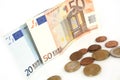 Euro banknotes and coins, cent, euro money on the white background