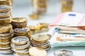 Euro banknotes and coins togetger on white table - close-up Royalty Free Stock Photo