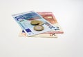 Euro banknotes with coins