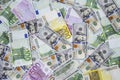 Euro banknotes and dollars randomly laid out 5