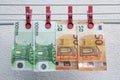 Euro banknotes drying. Washed Euro paper bills. Drying euro on a string.