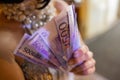 Euro banknotes. Euro Cash background. Close up of woman hands with euro money. Royalty Free Stock Photo