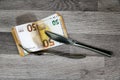 50 euro banknotes with fork and knife Royalty Free Stock Photo