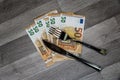 50 euro banknotes with fork and knife Royalty Free Stock Photo