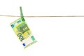 Euro banknotes hanging on a clothesline against white background. Money laundering concept Royalty Free Stock Photo