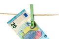 Euro banknotes hanging on a clothesline against white background. Money laundering concept Royalty Free Stock Photo