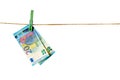 Euro banknotes hanging on a clothesline against white background. Money laundering concept Royalty Free Stock Photo