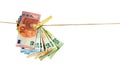 Euro banknotes hanging on a clothesline against white background. Money laundering concept Royalty Free Stock Photo