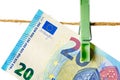 Euro banknotes hanging on a clothesline against white background. Money laundering concept Royalty Free Stock Photo