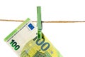 Euro banknotes hanging on a clothesline against white background. Money laundering concept Royalty Free Stock Photo