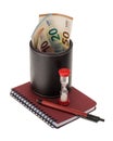 Euro banknotes in a leather holder, hourglass and writing materials. Time is money Royalty Free Stock Photo