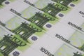 100 Euro banknotes are lined up in a row close up, money background