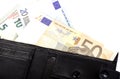 Euro banknotes in nominal value 5, 10, 20 and 50 in black purse. Royalty Free Stock Photo