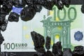 Euro banknotes on raw coal nuggets, bills on coal, power of money and ore Royalty Free Stock Photo