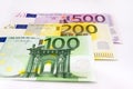 100, 200 and 500 euro banknotes on white. Close-up. Royalty Free Stock Photo