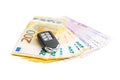 Euro banknotes and wireless car key Royalty Free Stock Photo