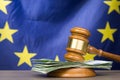 Euro banknotes with a wooden court gavel against european union Royalty Free Stock Photo