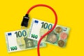 Euro banknotes on a yellow background. Energy crisis and expensive electricity, gas price. Royalty Free Stock Photo