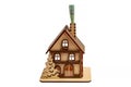Euro bill in chimney and a wooden toy symbolic house on white isolated background. Heating concept Royalty Free Stock Photo