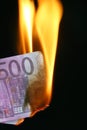 Euro bill on fire Royalty Free Stock Photo
