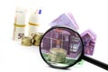 Euro bill House and expenses under magnifying glass Royalty Free Stock Photo